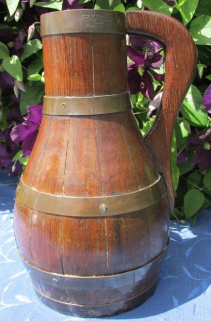 CR- CIDER JUG 11.75 IN 19th century Oak Ale or Cider Jug, coopered in brass and with turned base